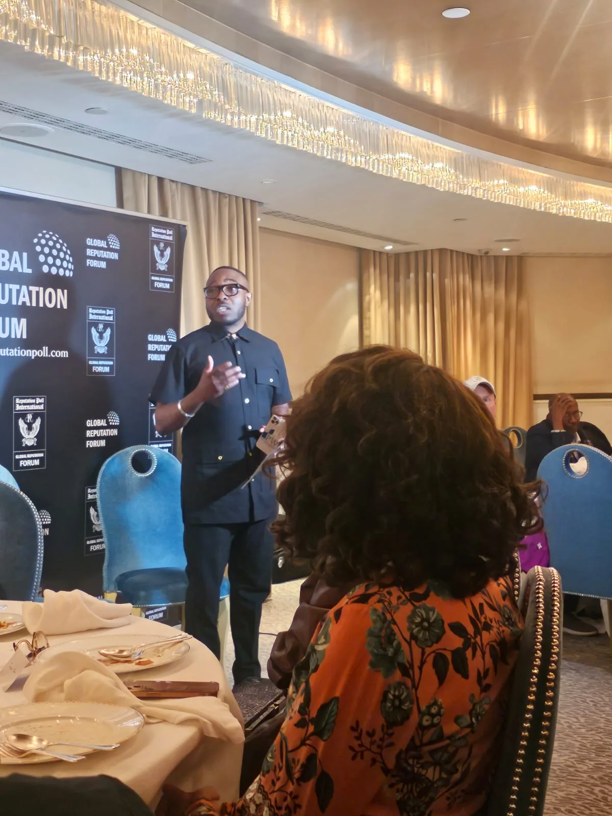 Dr Moses speaking with attendees